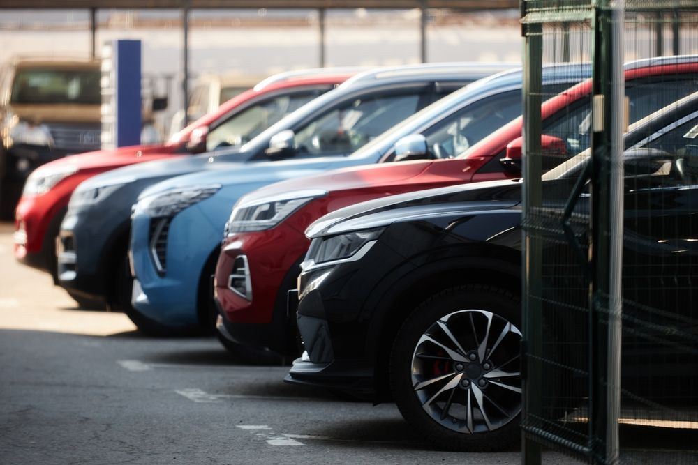 Selection of rental cars including compact, SUV, electric, and luxury models