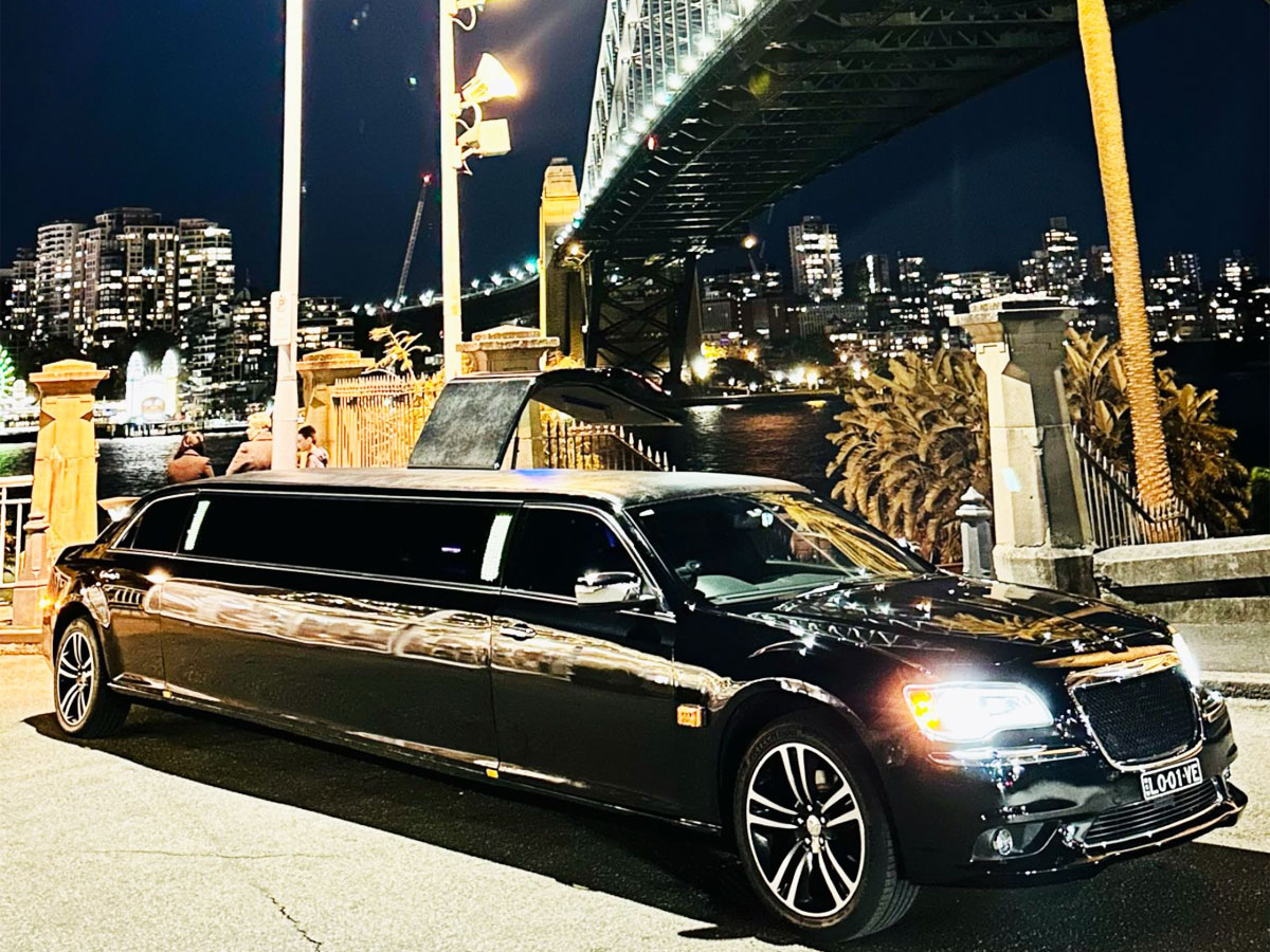 A newlywed couple stepping out of a luxury limousine at their wedding venue