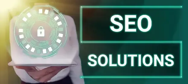 A woman is holding a laptop in front of a sign that says seo solutions.