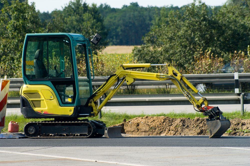 Mini Excavator On Road — Excavation in Coffs Harbour, NSW