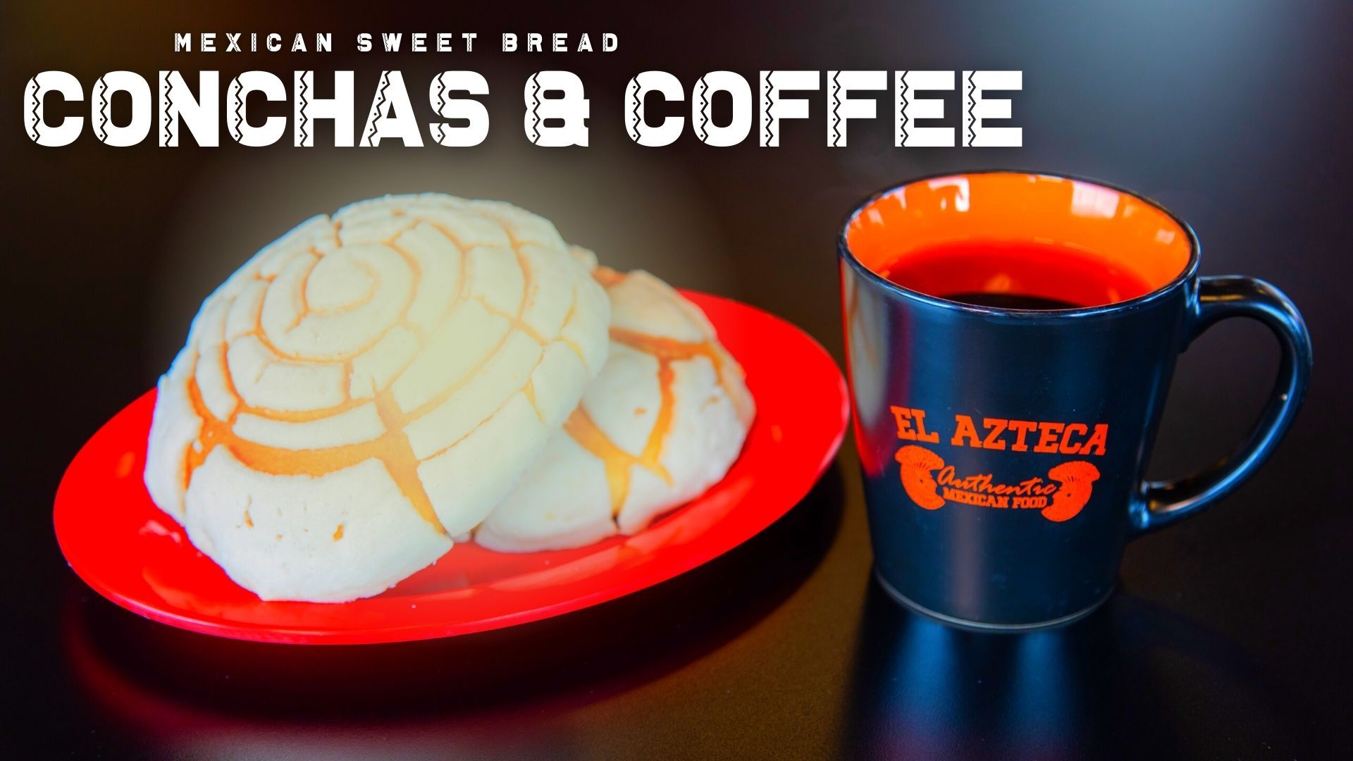 A cup of coffee next to a plate of conchas