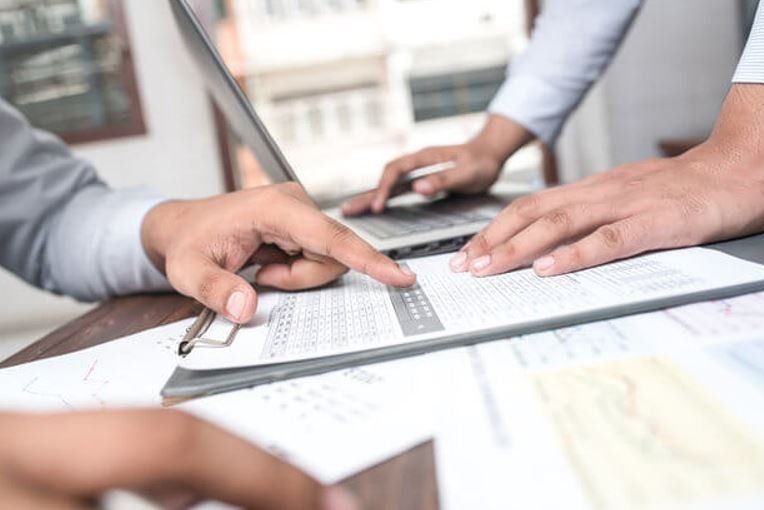 Accountants and website designers meeting at a table