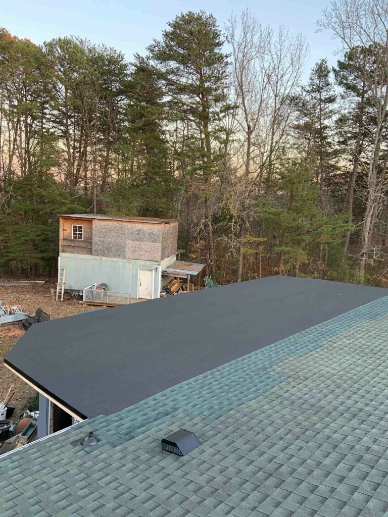 The Roof Of A House With A Shed In The Background - Charlotte, NC - Valhalla Roofing