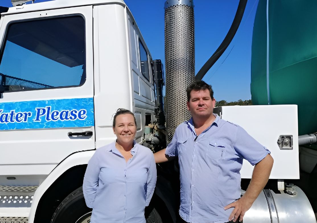 A Man and a Woman Are Standing in Front of a Truck — Water Please In Brunswick Heads, NSW