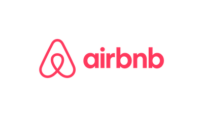 The Airbnb logo in a coral-pink color against a white background.
