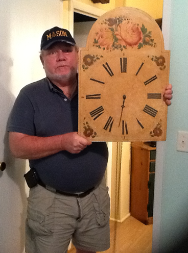 The Owner Holding An Old Clock — Charleston, SC — Captain Mikes Clock Shop