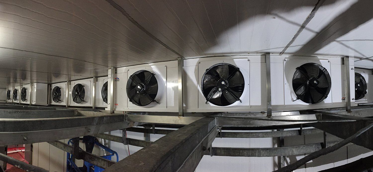A Row Of Refrigeration Fans Are Hanging From The Ceiling Of A Building — Macleay Air In West Kempsey, NSW