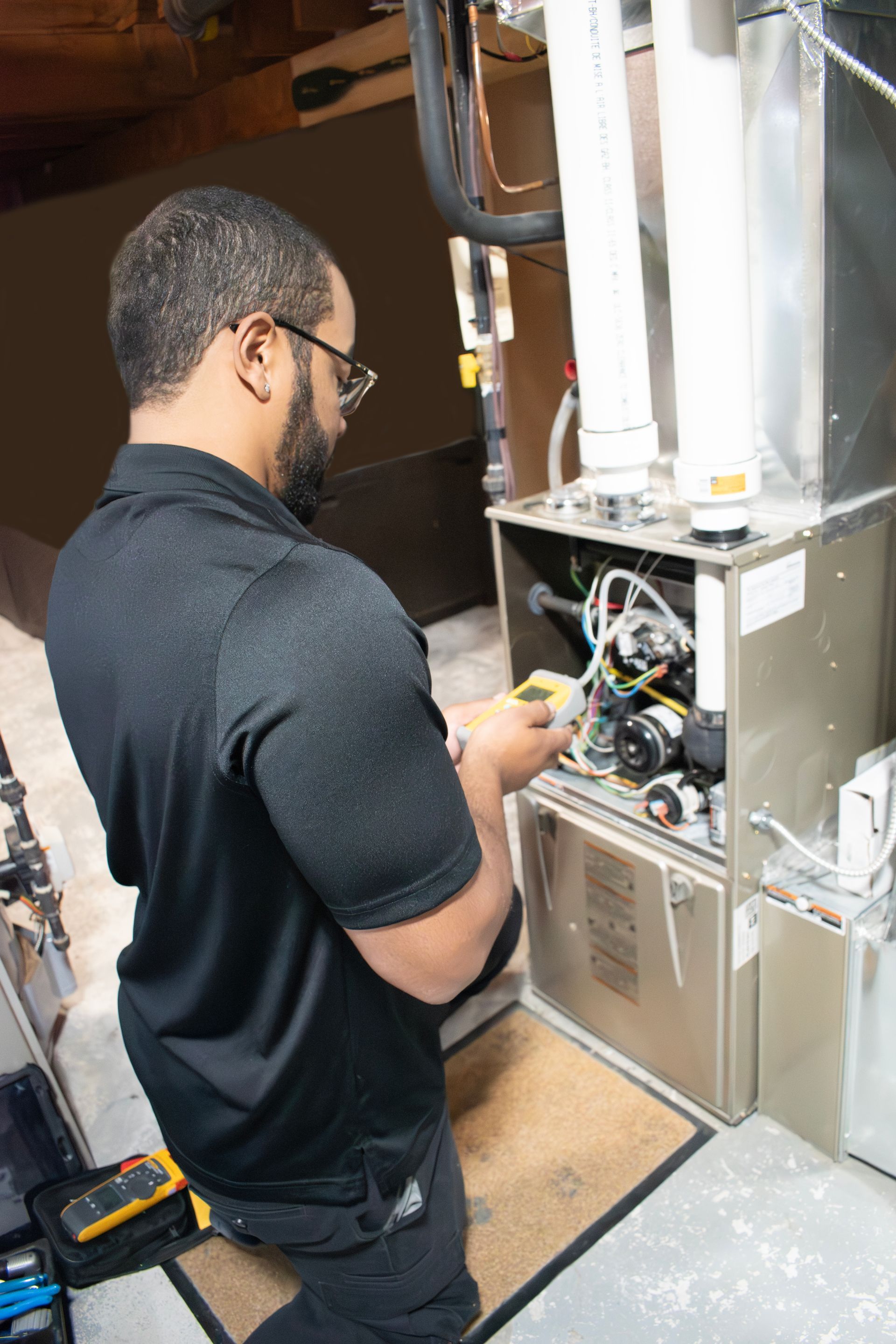 Technician working on a residential furnace