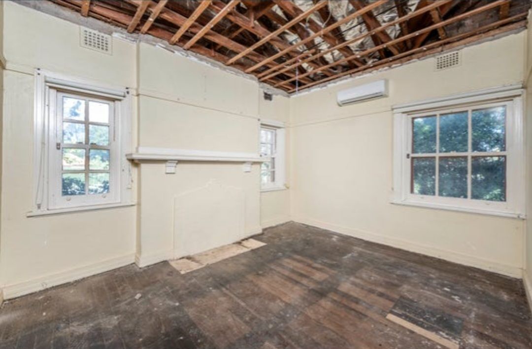 Room Interior With Exposed Ceiling Beams, Windows, Old Wood Floors, and Walls  — Elimar Construction in Goulburn, NSW