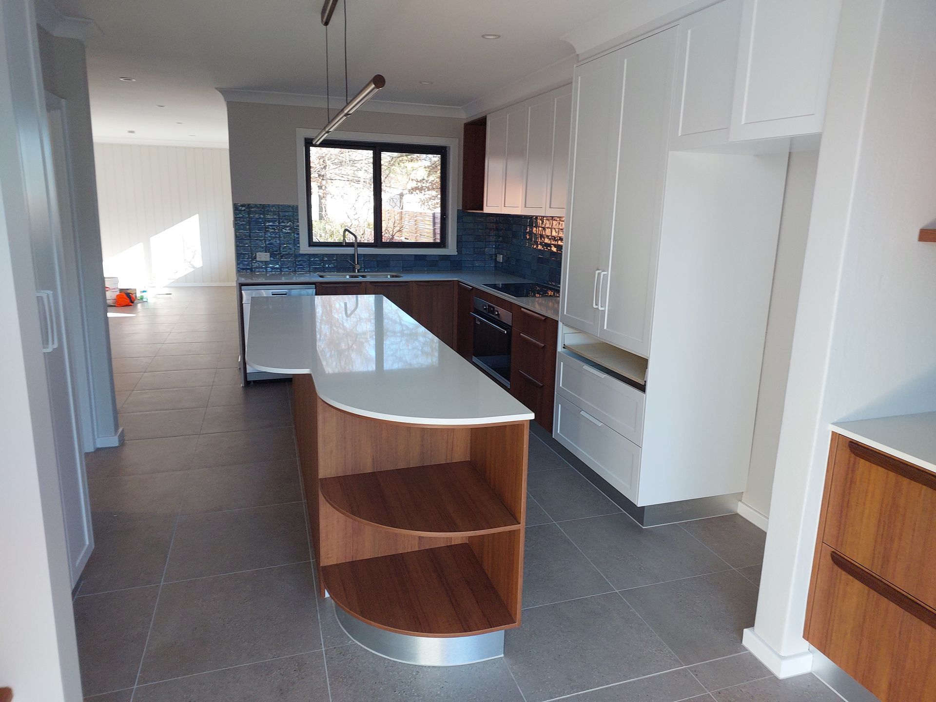Modern Kitchen With White Cabinets, Wood Island and Countertops — Elimar Construction in Goulburn, NSW