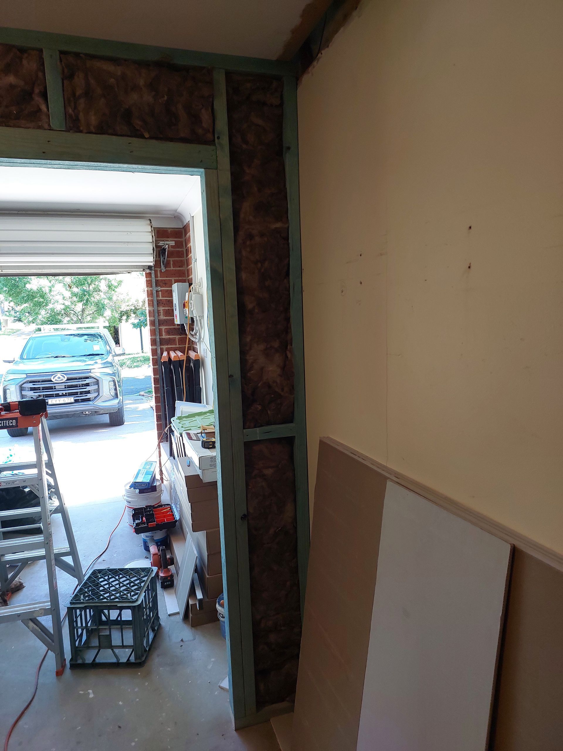 Garage Doorway Construction; Insulation in Frame; Truck Parked Outside — Elimar Construction in Goulburn, NSW