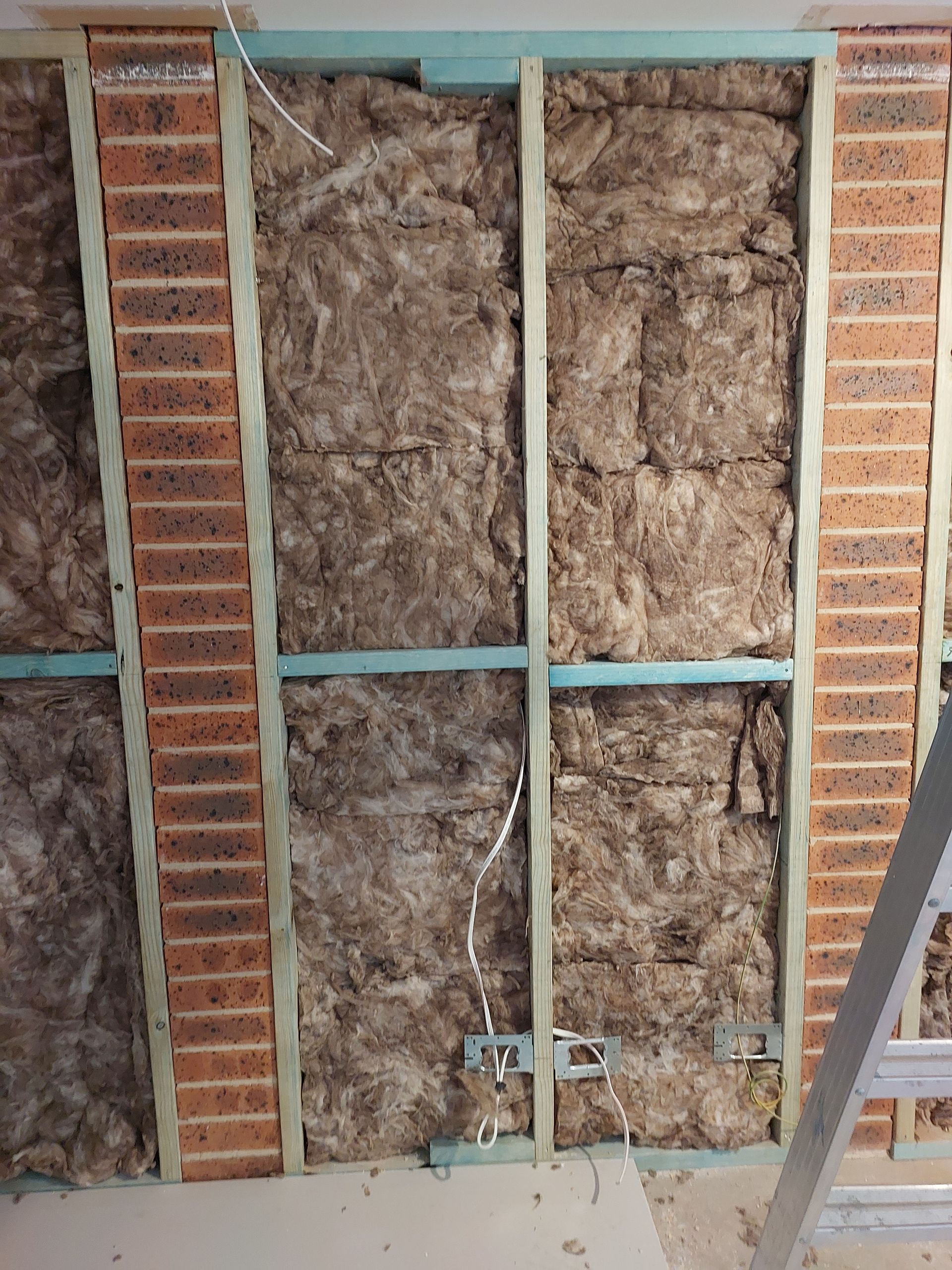 Brick and Wood Frame With Insulation. Electrical Wiring Visible — Elimar Construction in Goulburn, NSW