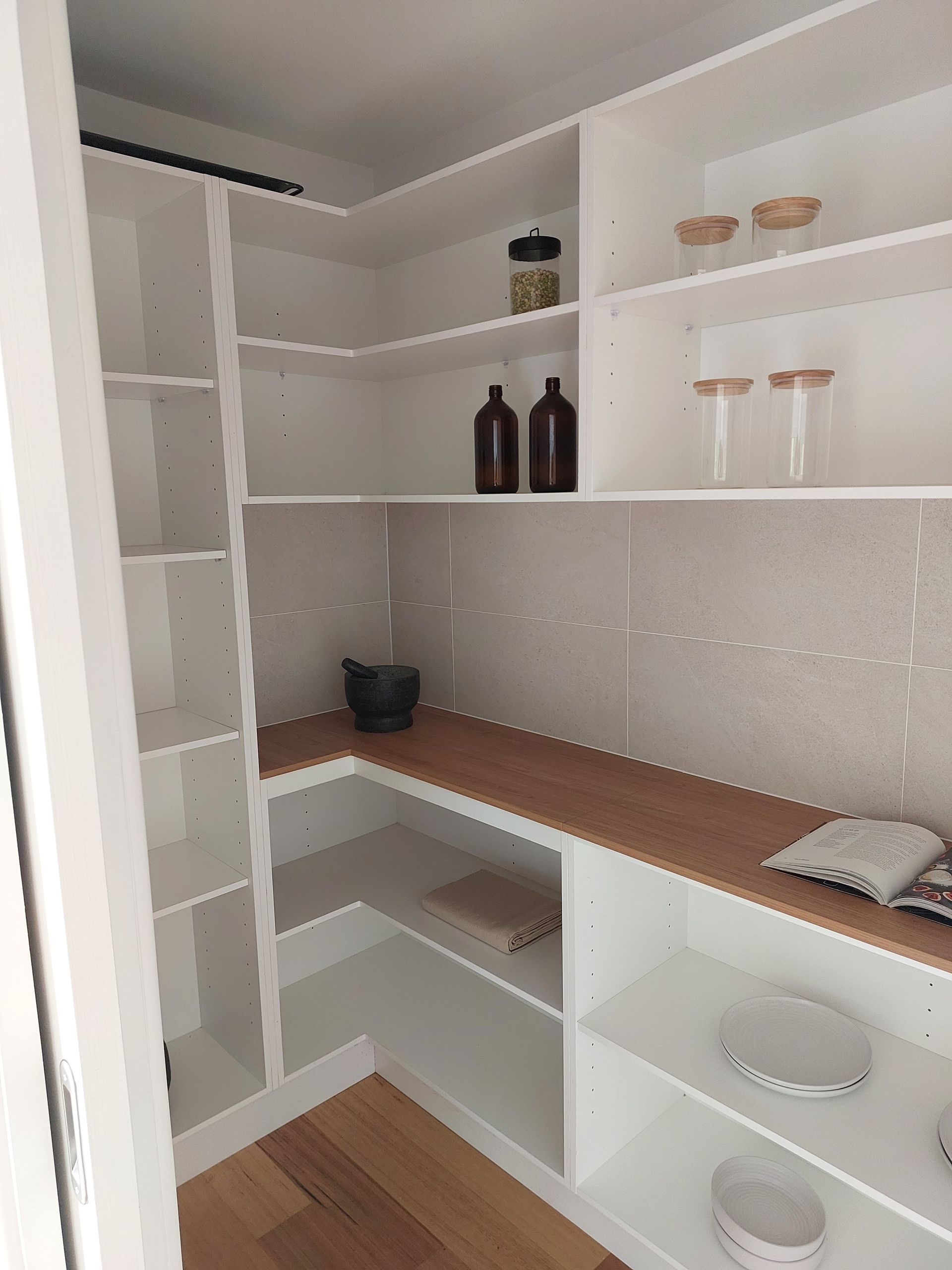 White Pantry With Wooden Countertops and Shelves, Containing Jars and Dishes — Elimar Construction in Goulburn, NSW