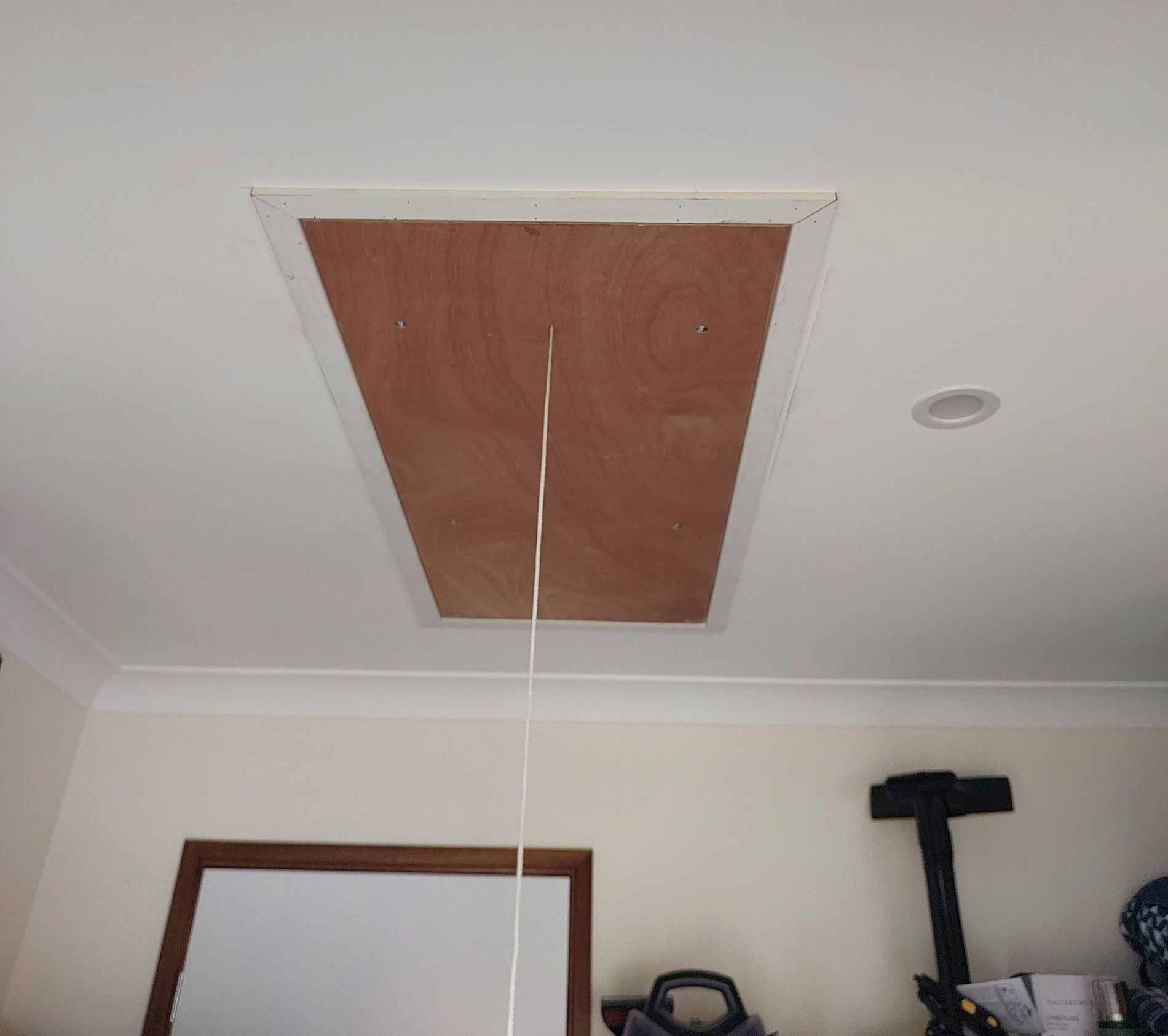 A Garage With a Brick Wall and a Gray Floor — Elimar Construction in Goulburn, NSW