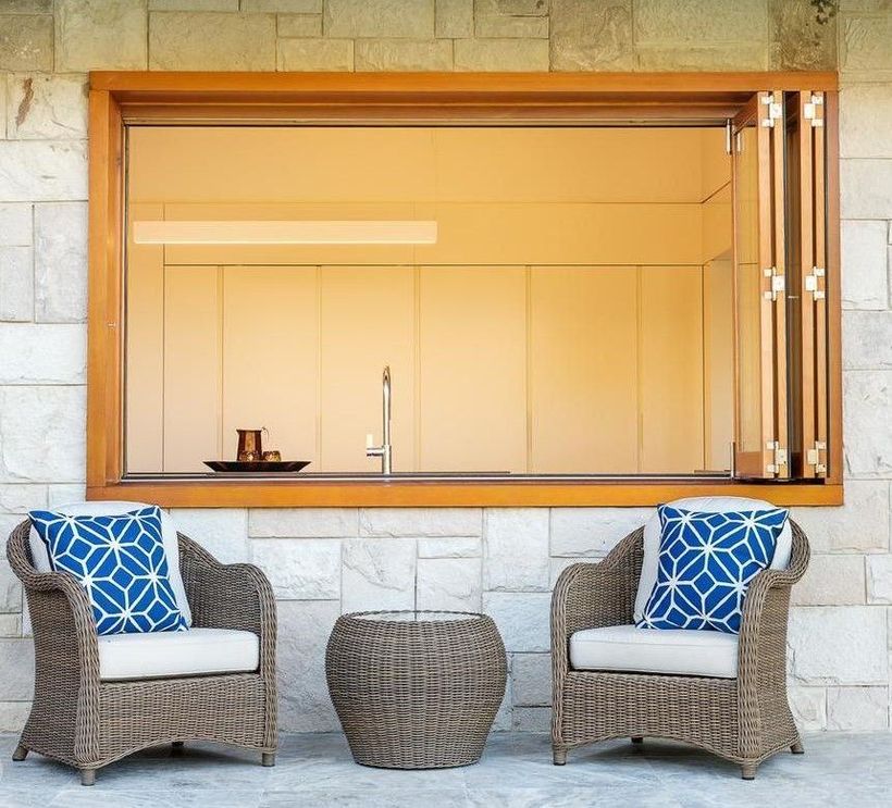 Two Chairs Next to a Large Window — Elimar Construction in Goulburn, NSW