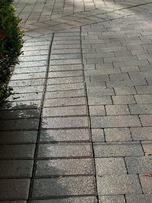 a before and after picture of a brick walkway