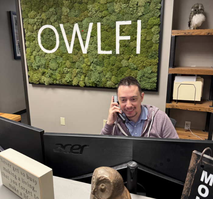 Man on phone at a desk with 