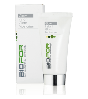 A tube of biofor instant glam moisturizer next to its box