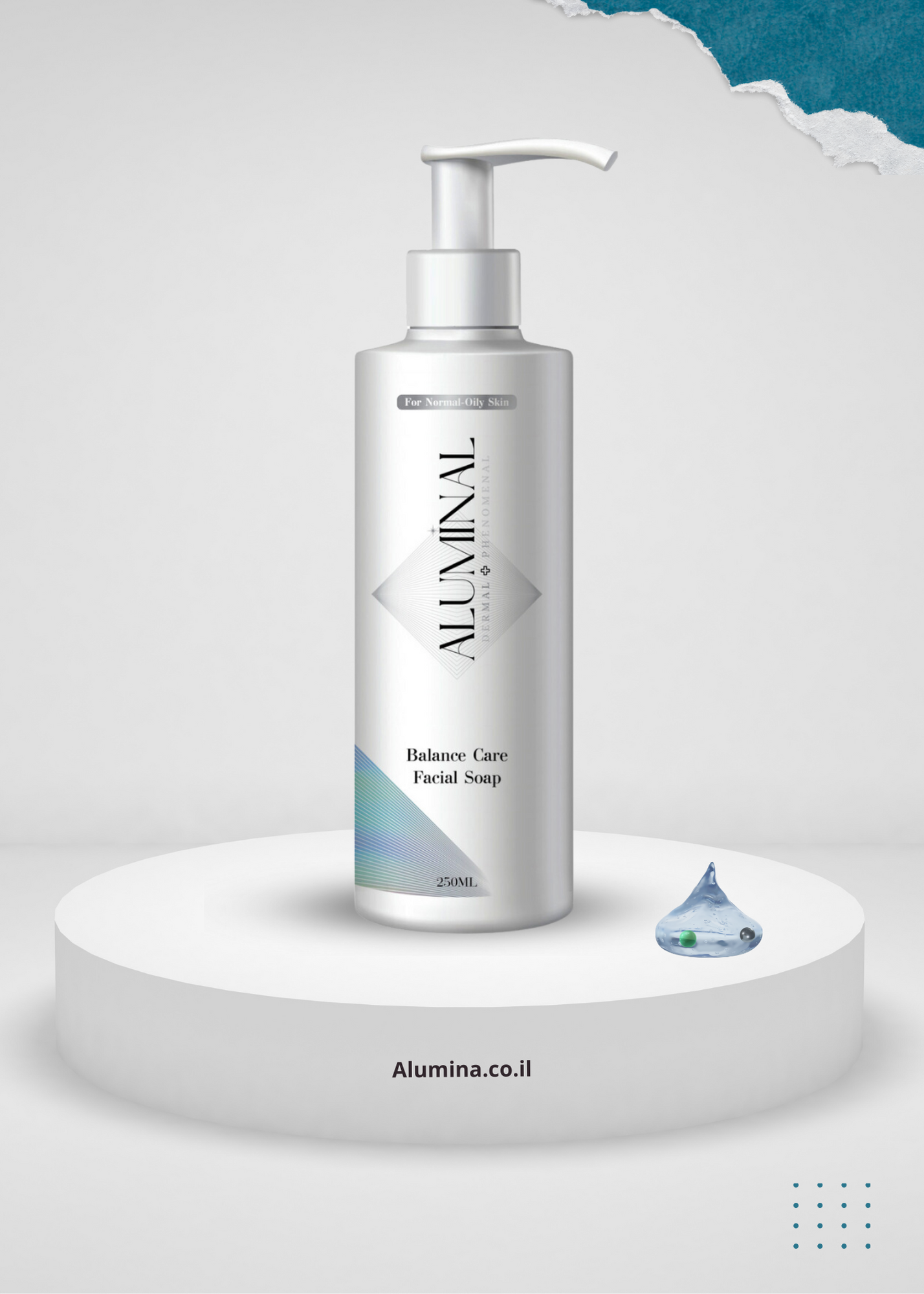 A bottle of hand soap is sitting on top of a white podium.