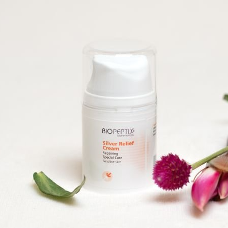 A white bottle of biopeptide silver relief cream