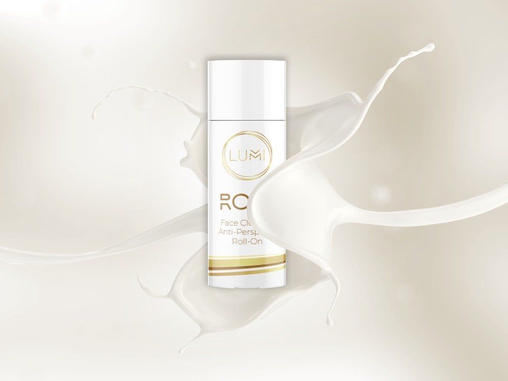 A bottle of lotion with a splash of milk on a white background.