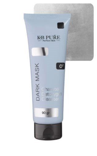A tube of kh pure dark mask is sitting on a white surface.