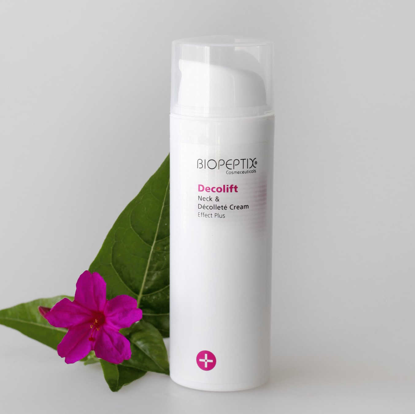 A bottle of biopeptide decolift next to a purple flower