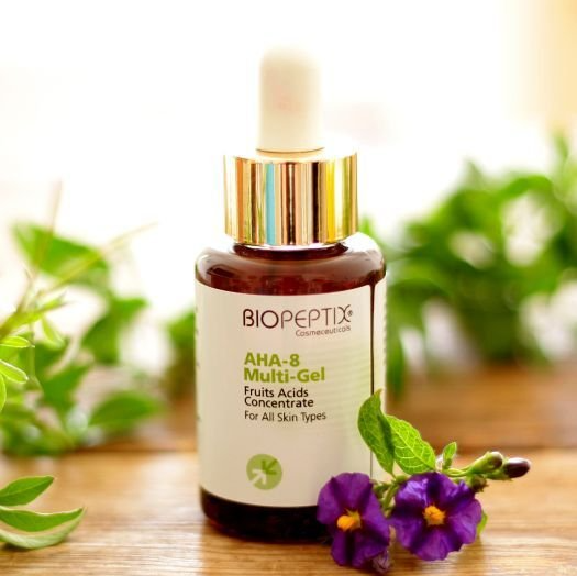 A bottle of biopeptix multi gel sits on a wooden table