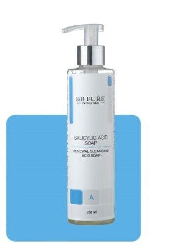 A bottle of salicylic acid soap on a blue background