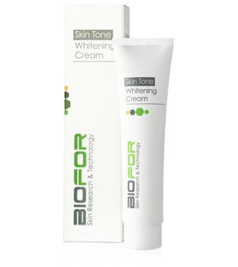 A tube of biofor skin tone whitening cream next to its box
