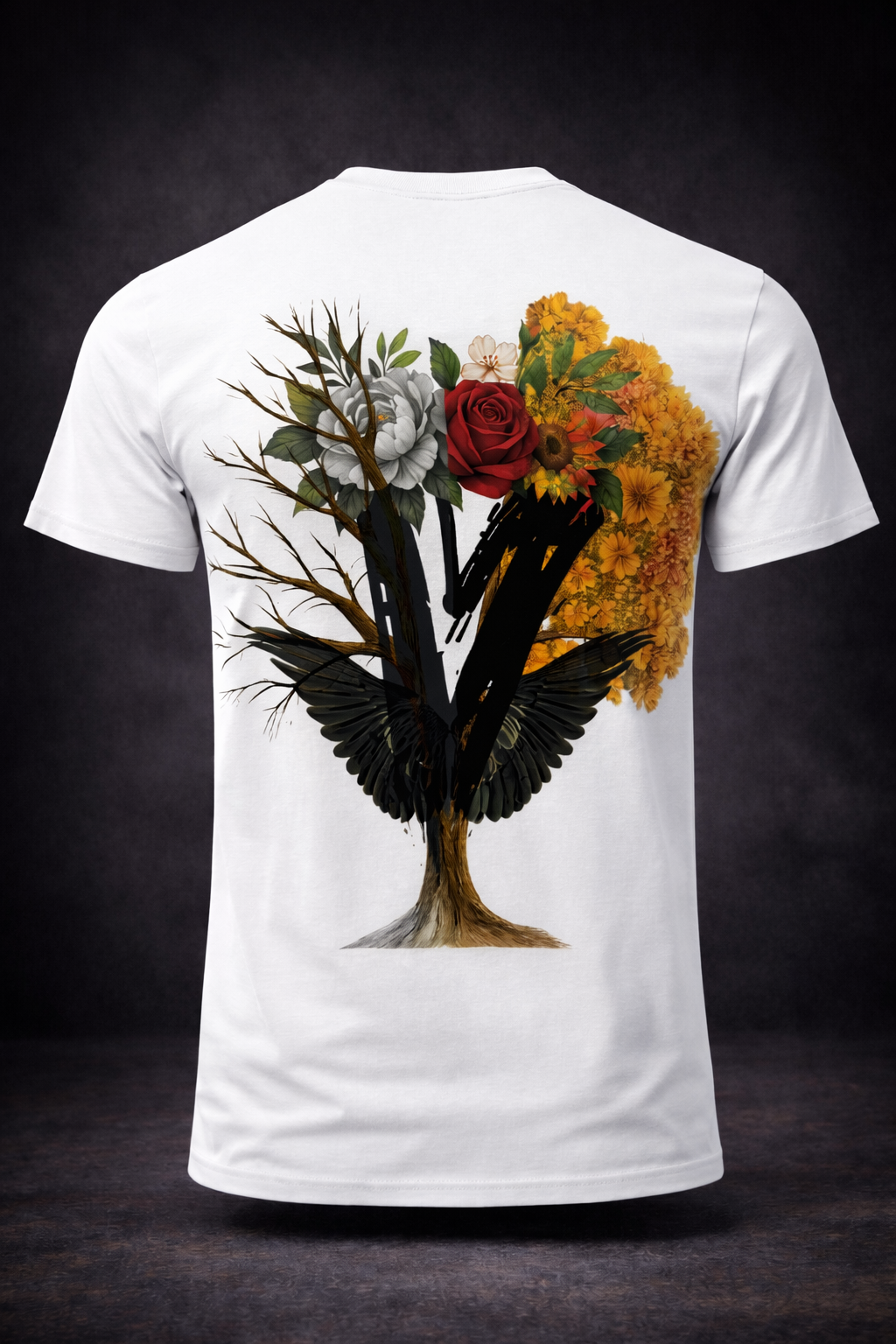 White t-shirt with a tree design: branches, flowers, and two black bird-like wings.