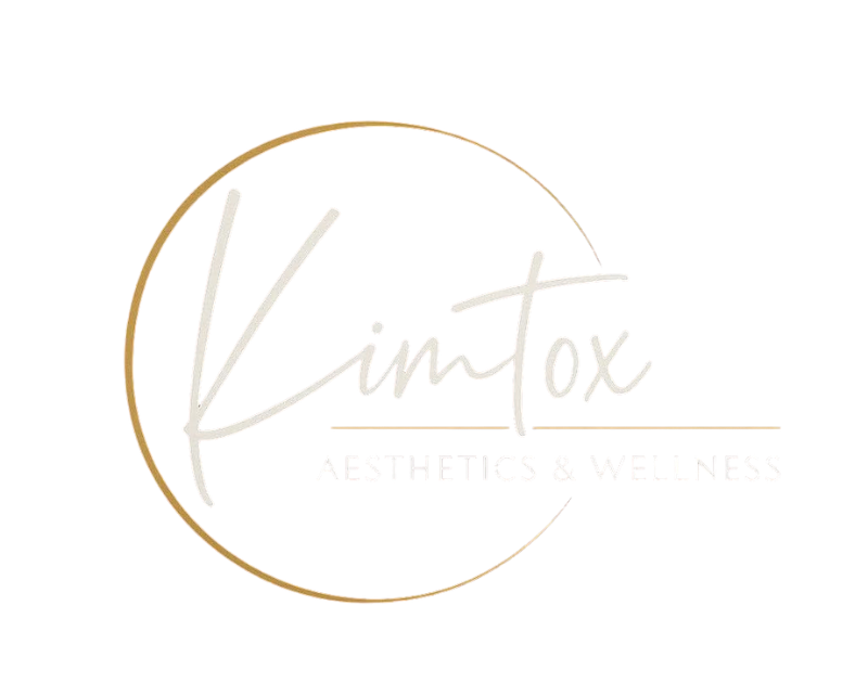 Gold circular logo with pale script text reading &ldquo;Kimtox Aesthetics & Wellness&rdquo;