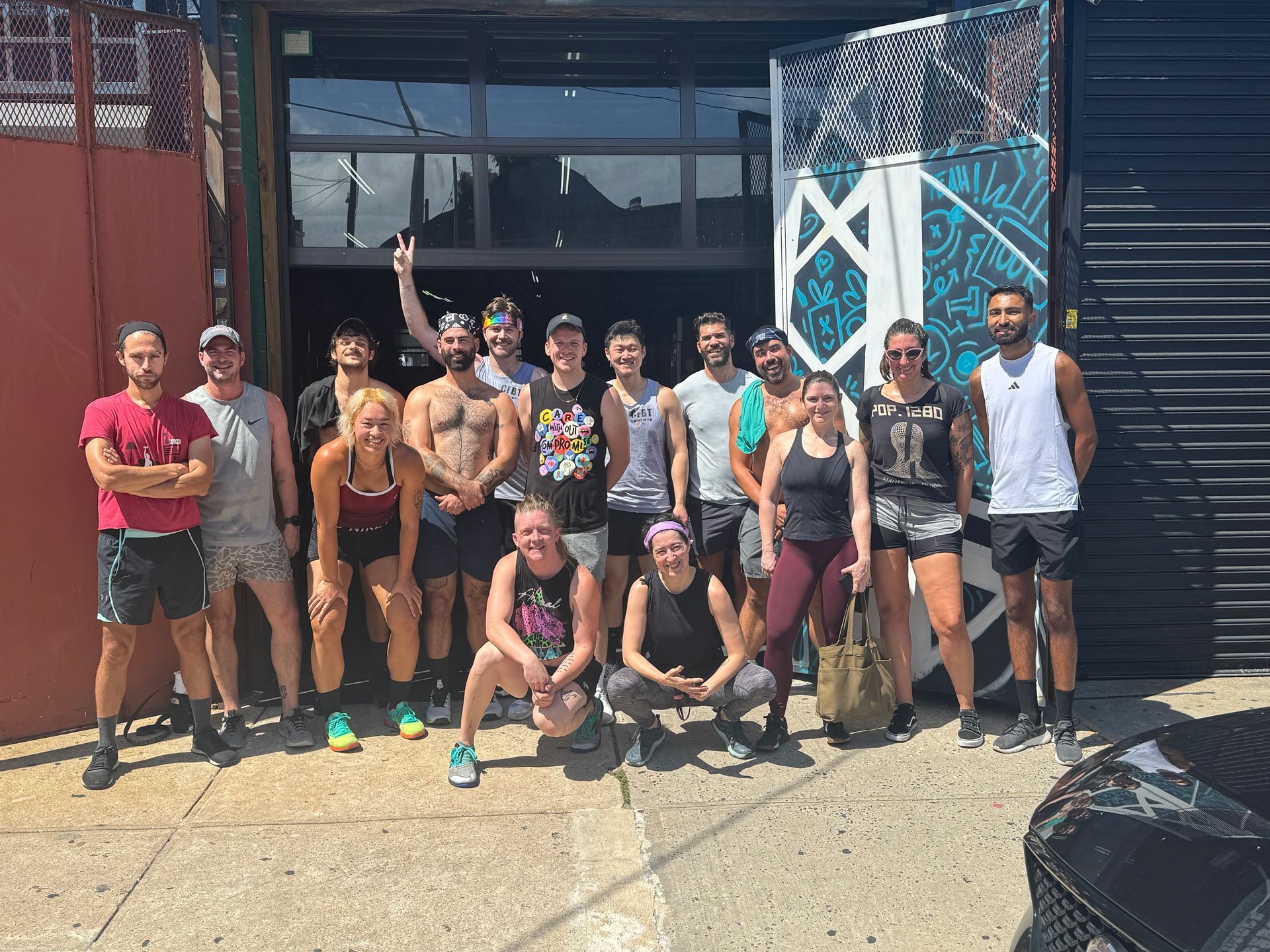 Rainbow flag with horizontal stripes: red, orange, yellow, green, blue, and purple.