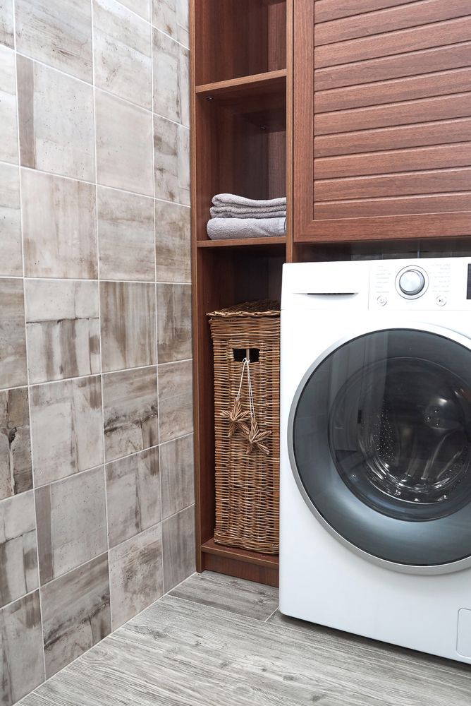 Laundry Room With a Washing Machine — Platinum Kitchens & Bathrooms in Nambucca Heads, NSW