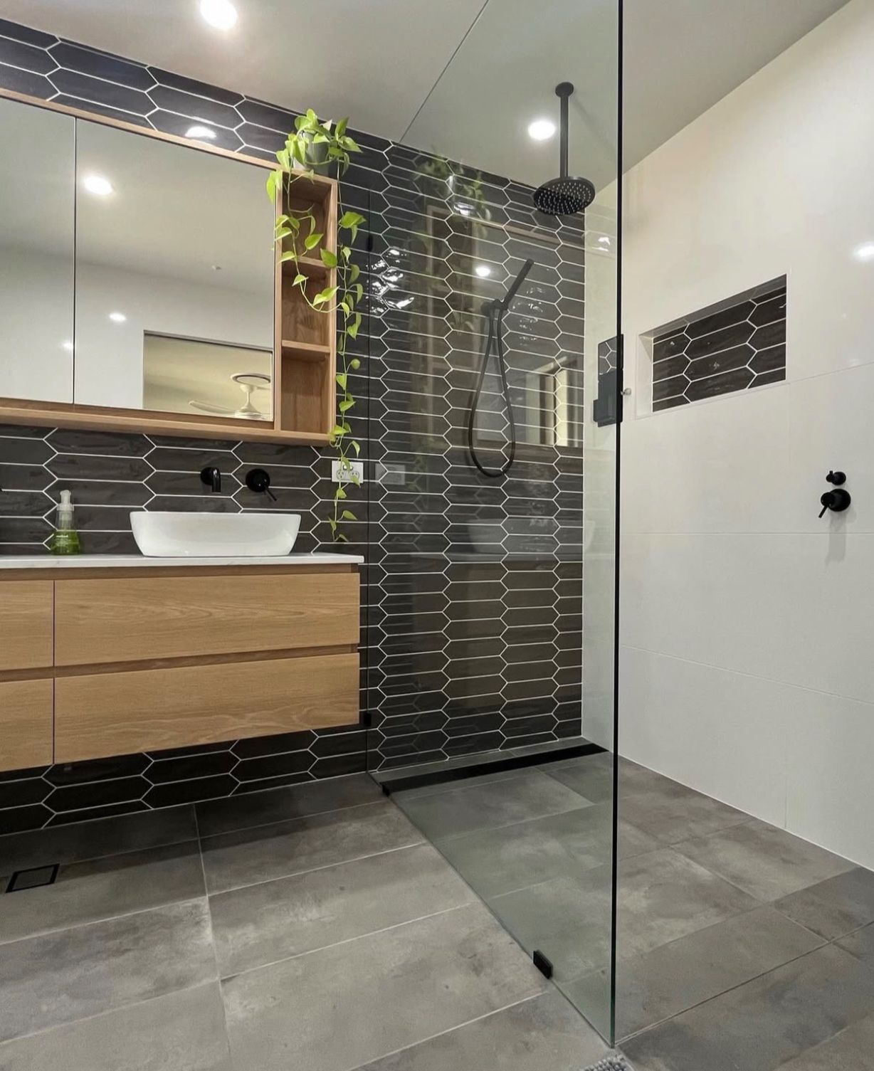White Freestanding Bathtub in a Light Green Bathroom — Platinum Kitchens & Bathrooms in North Boambee Valley, NSW