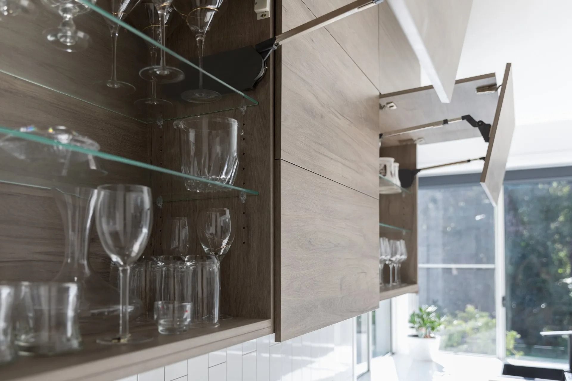 Open Kitchen Cabinet with Glassware — Platinum Kitchens & Bathrooms in North Boambee Valley, NSW
