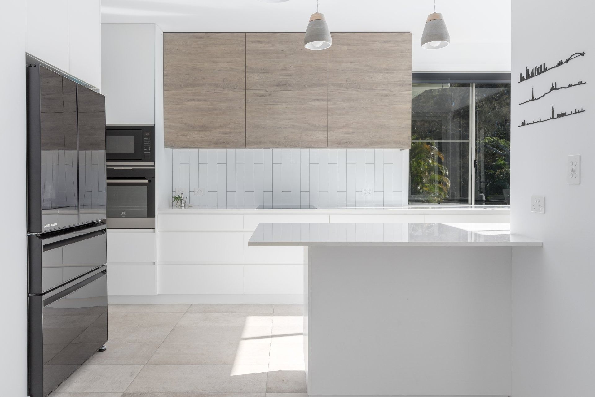 Modern White Kitchen with Island — Platinum Kitchens & Bathrooms in North Boambee Valley, NSW