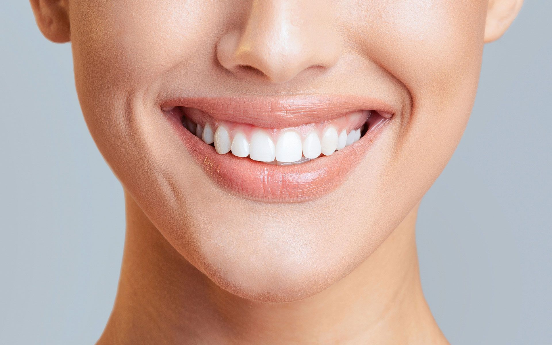 Smiling woman with bright white teeth.