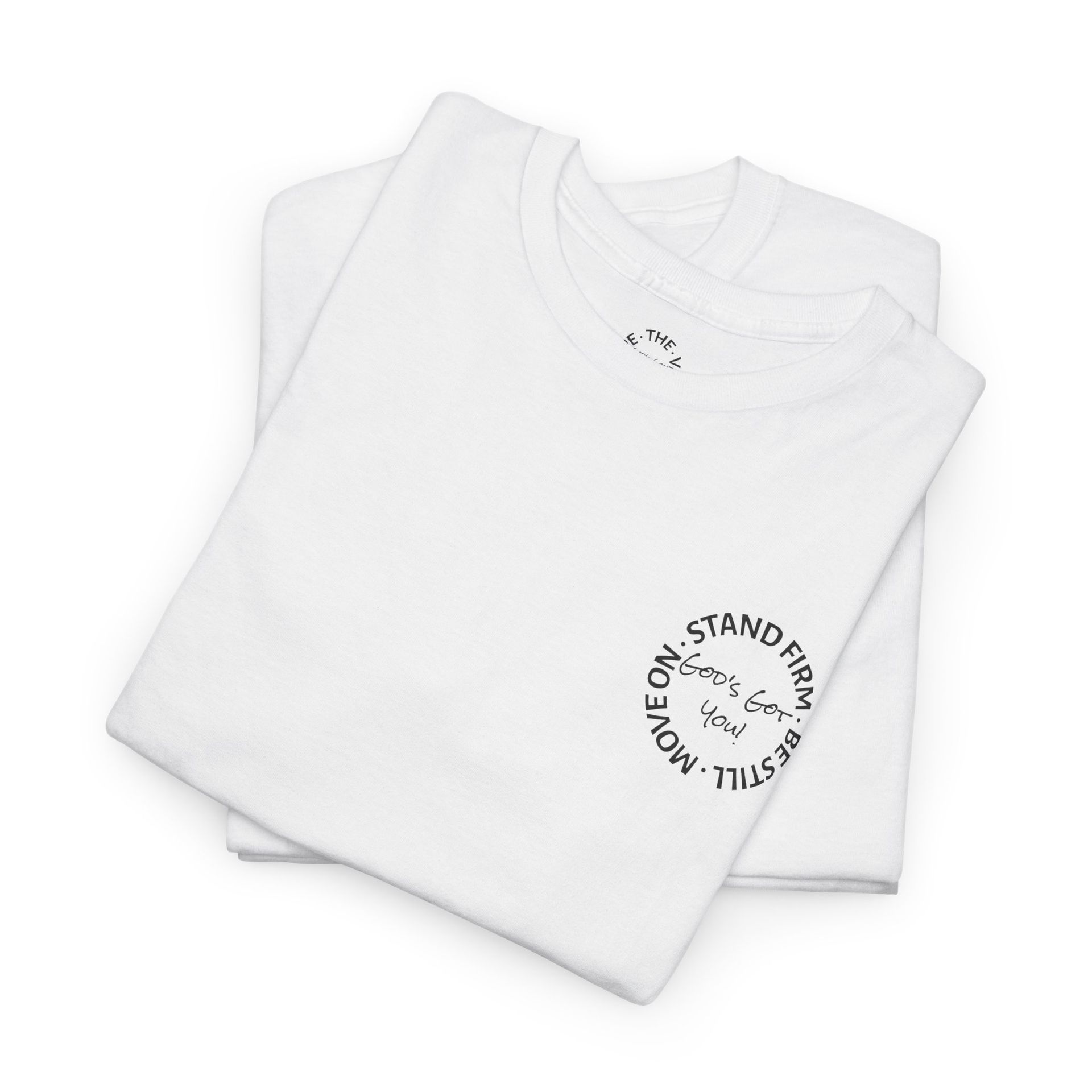 Woman wearing a white t-shirt with a small logo, and blue jeans smiles at the camera.