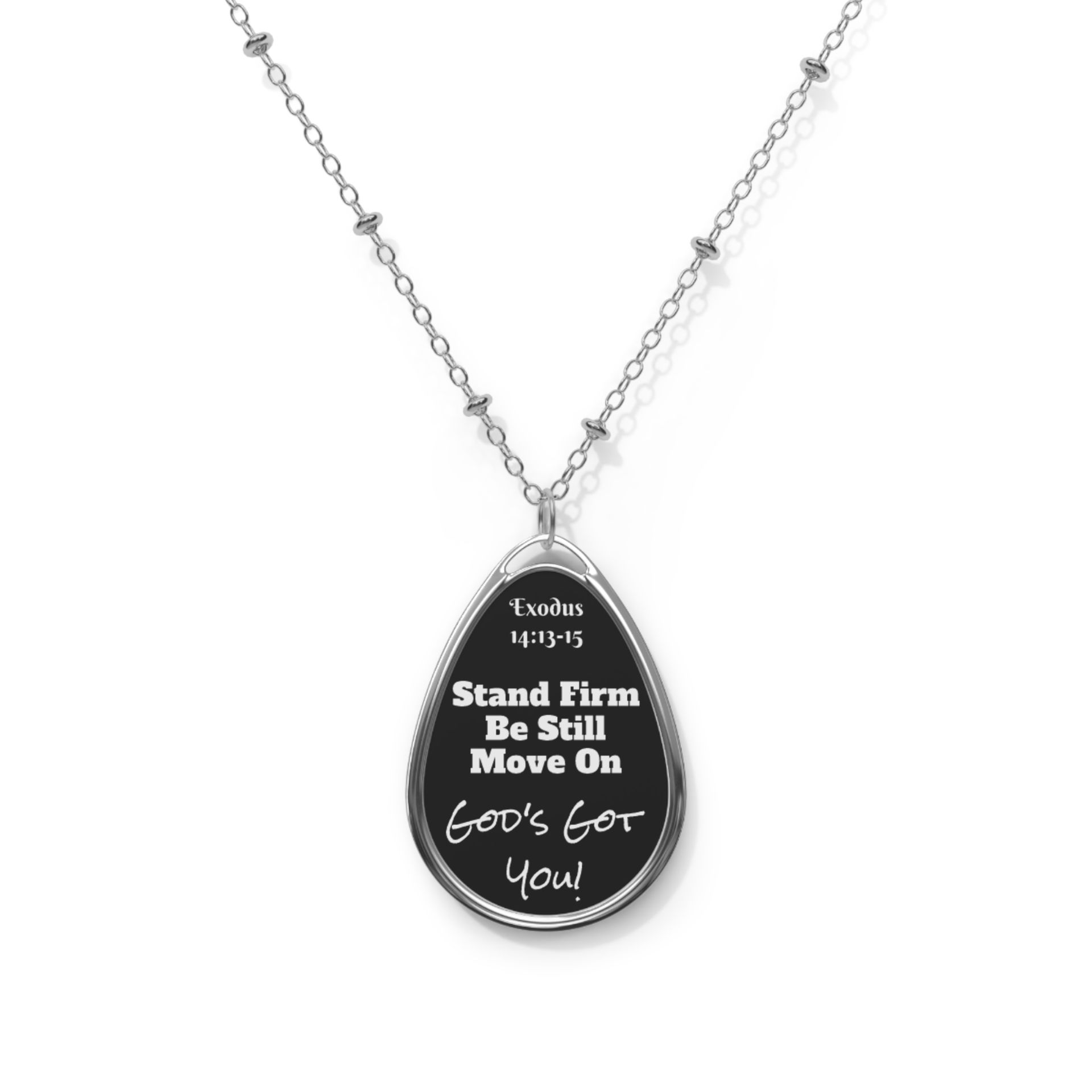 Silver pendant necklace with a black oval pendant. The pendant has the text "Stand Firm, Be Still, Move On, God's For You!".