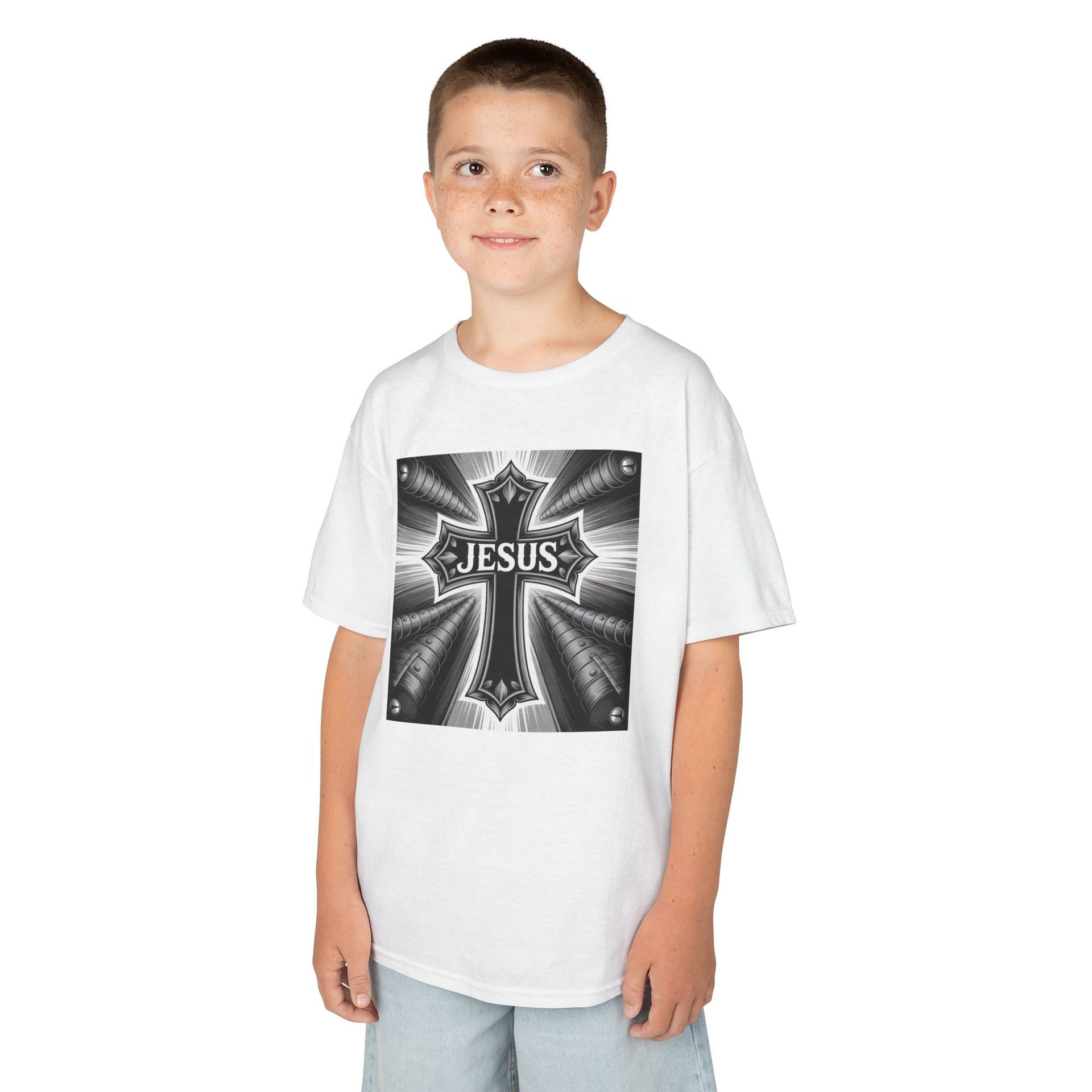 Boy wearing a white t-shirt with a black and white cross design.