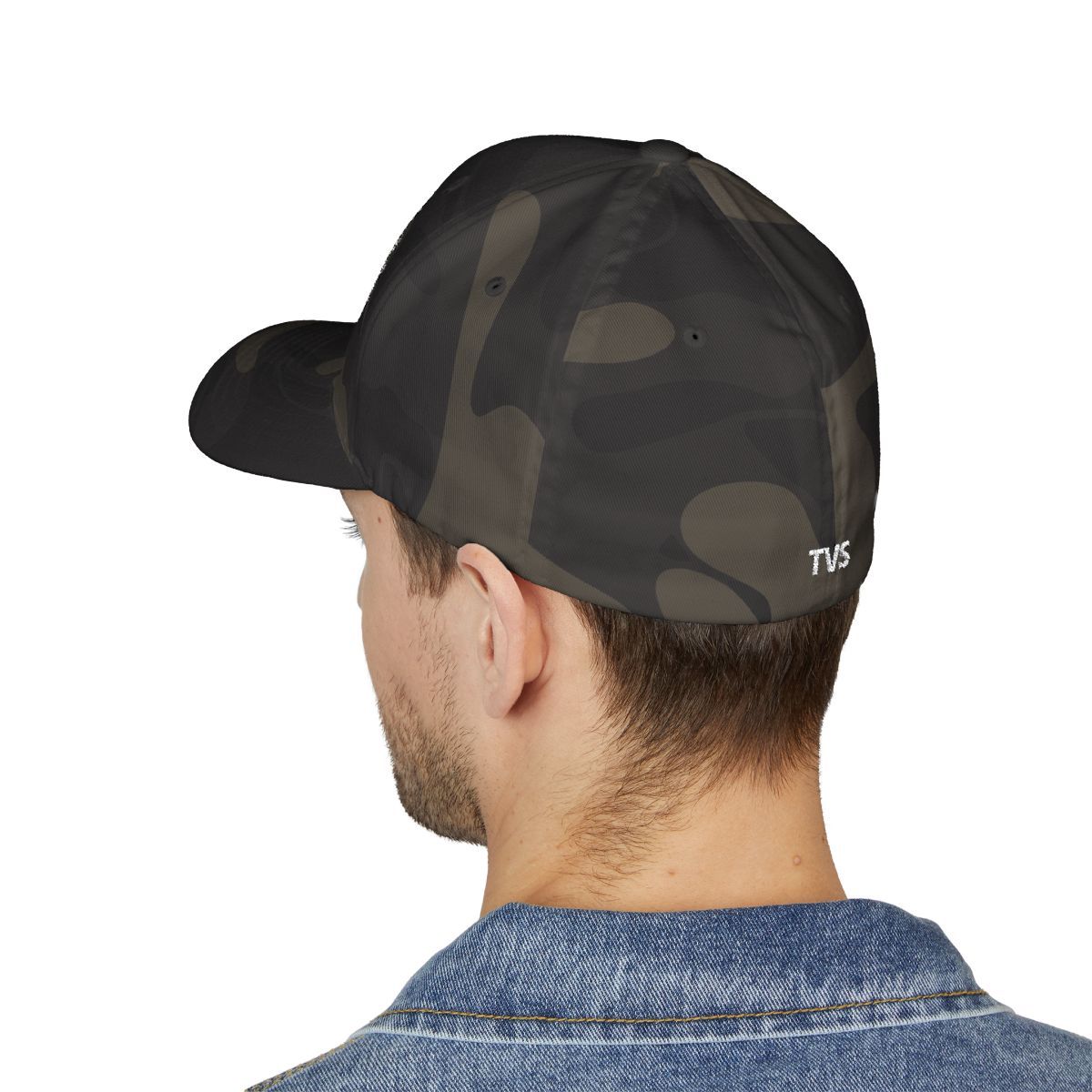 Man wearing a black camouflage baseball cap. The cap has the letters 