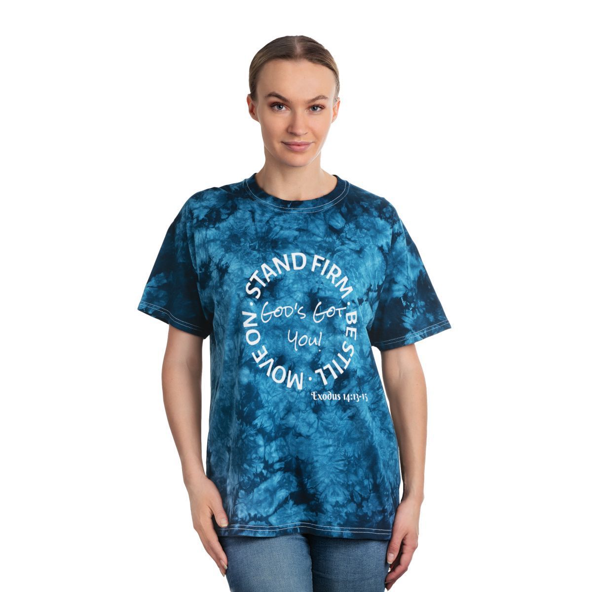 Woman wearing a blue tie-dye shirt with white text: 