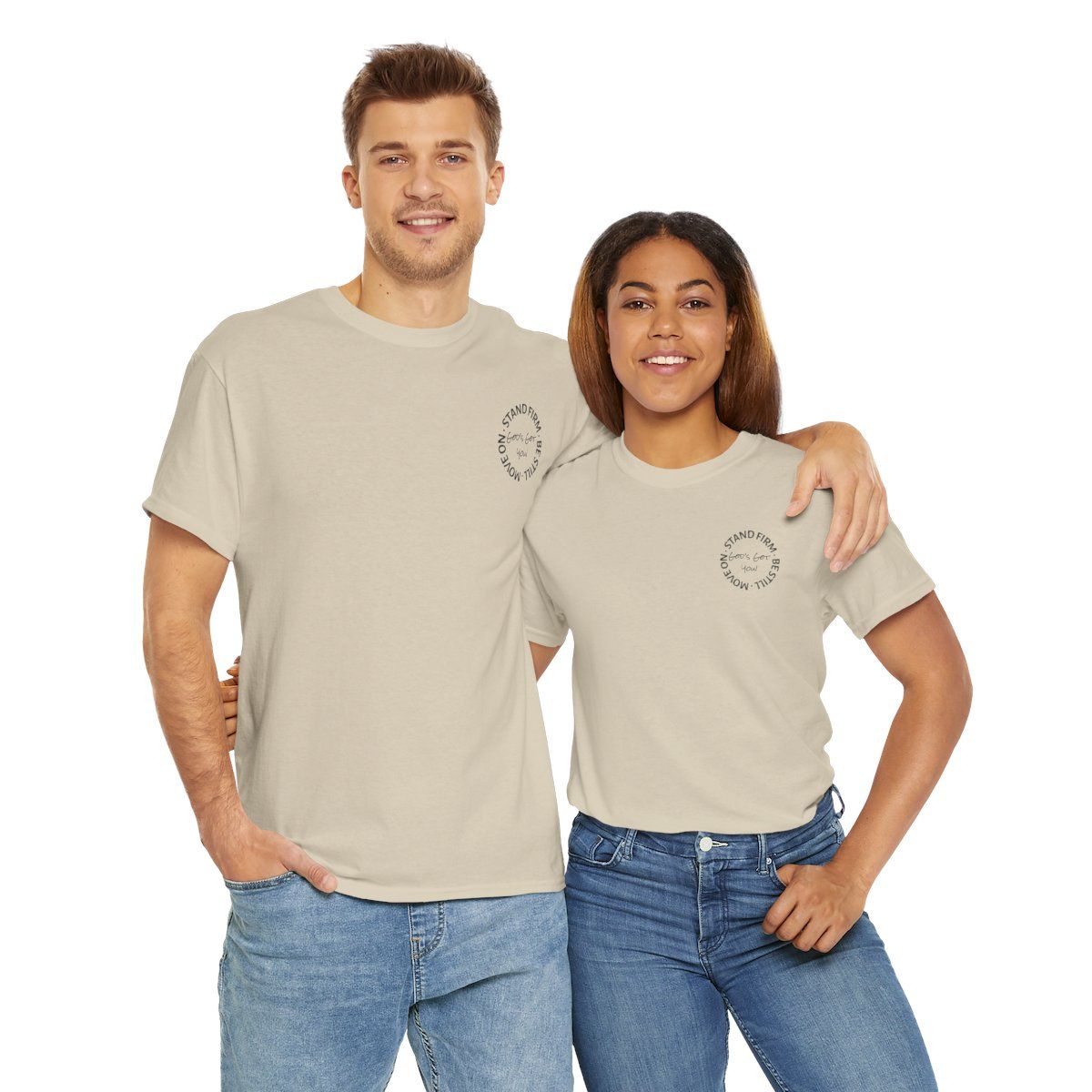 Man and woman wearing tan t-shirts, smiling, both with a small design on the chest.