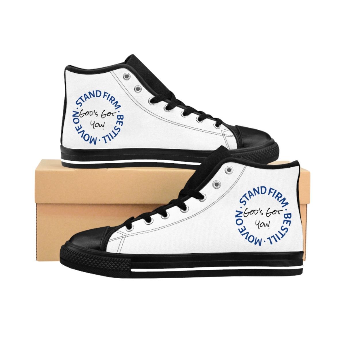 White high-top sneakers with black trim and inspirational text on a light brown box.