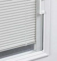 Close-up of a white window with closed white horizontal blinds. The blinds are pulled down.