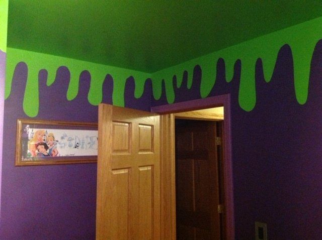A room with purple and green paint on the walls