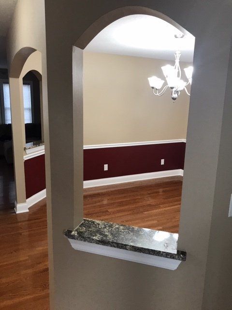 A view of a dining room through a window