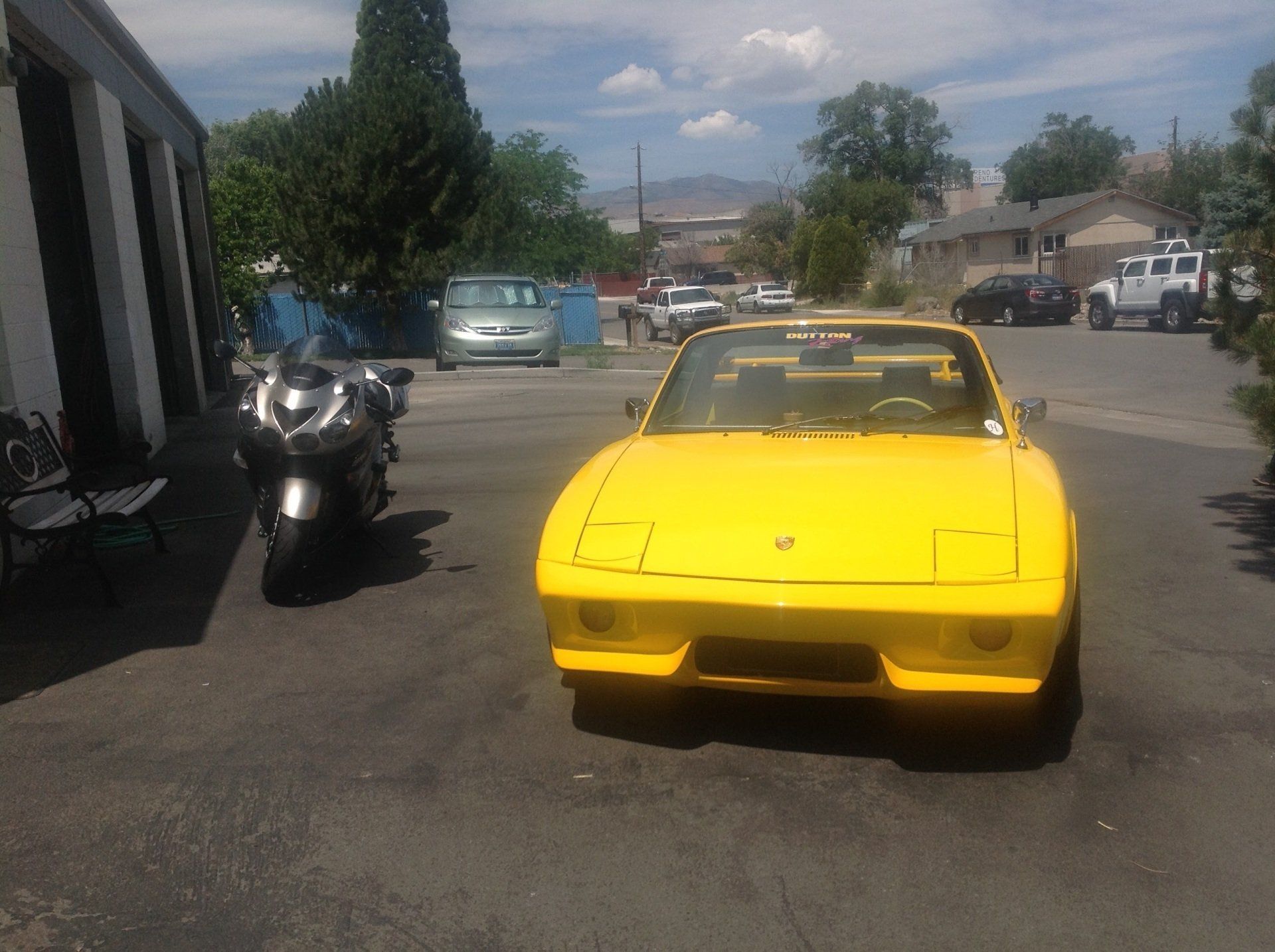 Yellow Car and Black Motor Bike — Sparks, NV — Sam’s Sparkle Shop