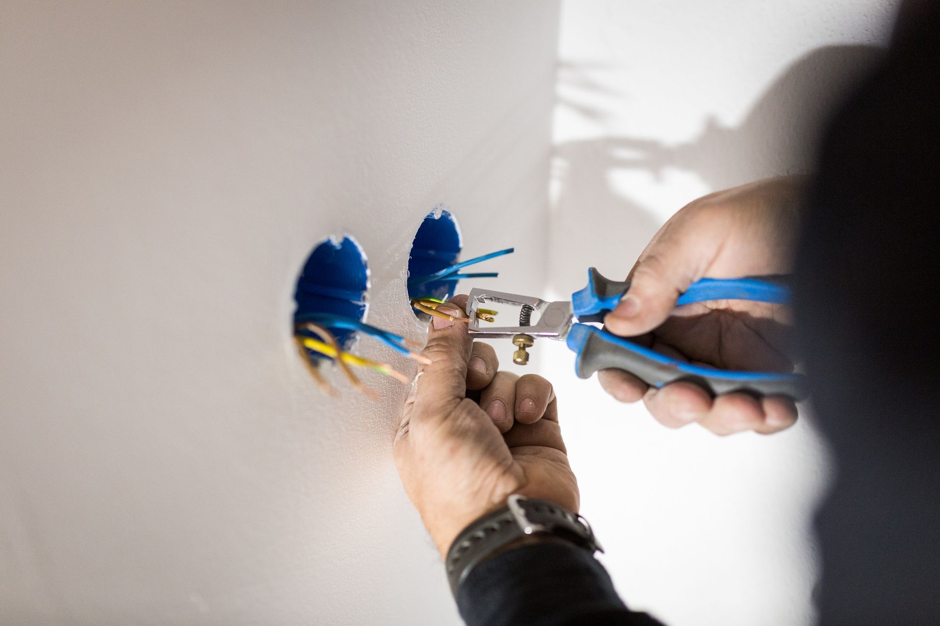 Person Is Cutting Wire - Springfield, MA - CB Electric Inc.